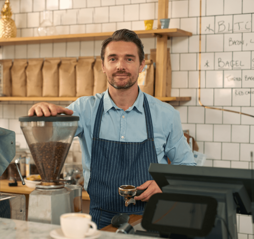 Coffee shop owner behind the counter